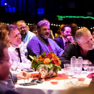 Stars at Table on Stage