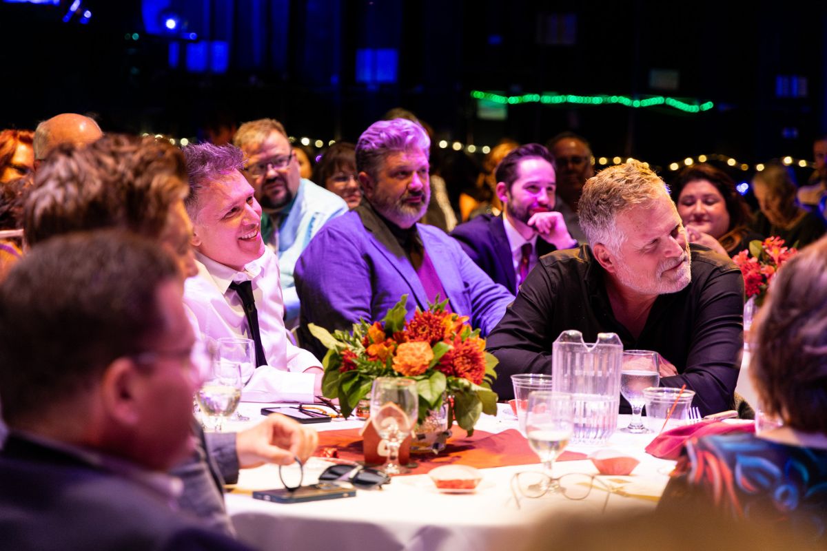 Stars at Table on Stage